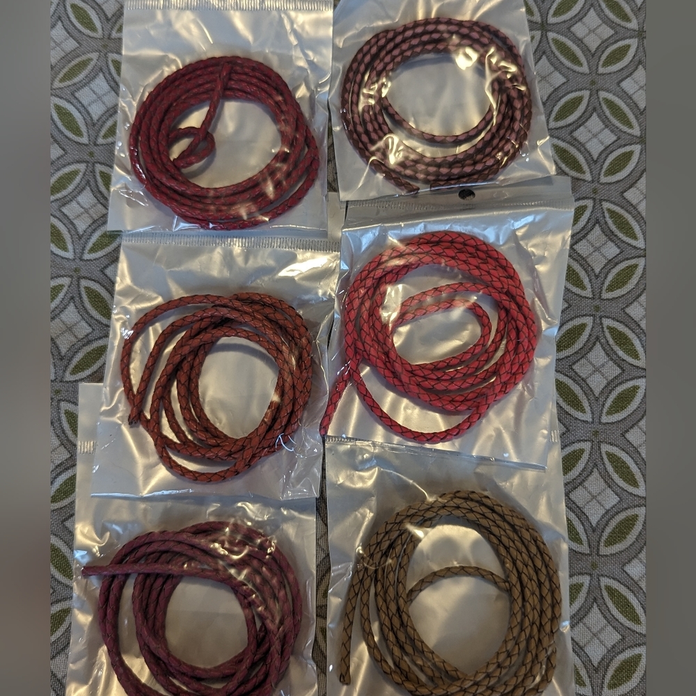6 packages of warm colored braided leather chording 3 MM each. 40 " per chord